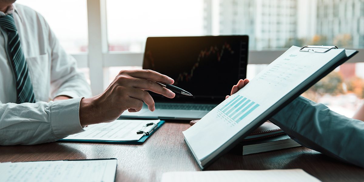 Group of usiness partnership coworkers working to chart company